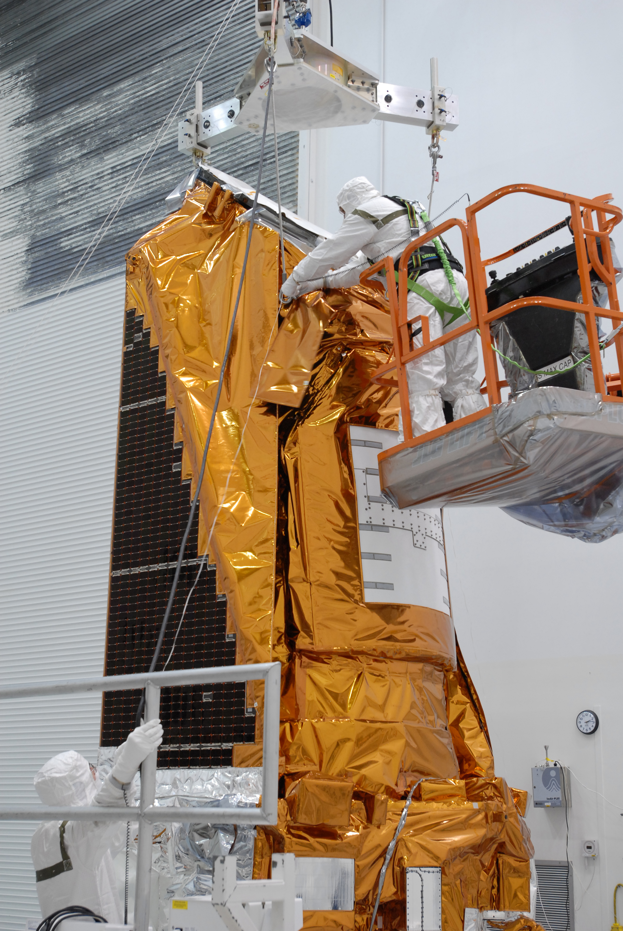 Cables being attached to Kepler; from NASA